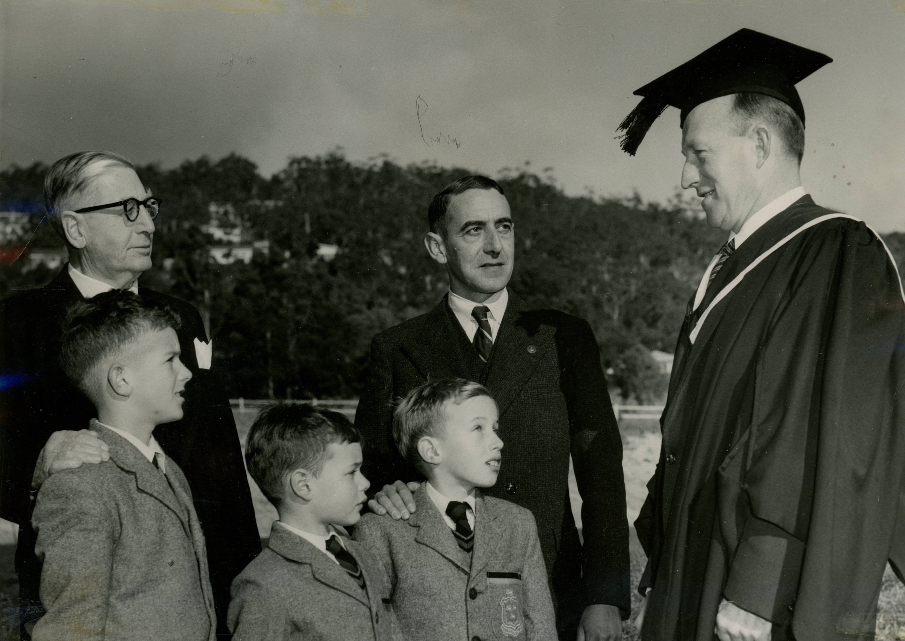 Mr V Chambers, Mr L Chambers and Headmaster G H Newman with P Chambers, B Chambers and J Chambers, 1960
