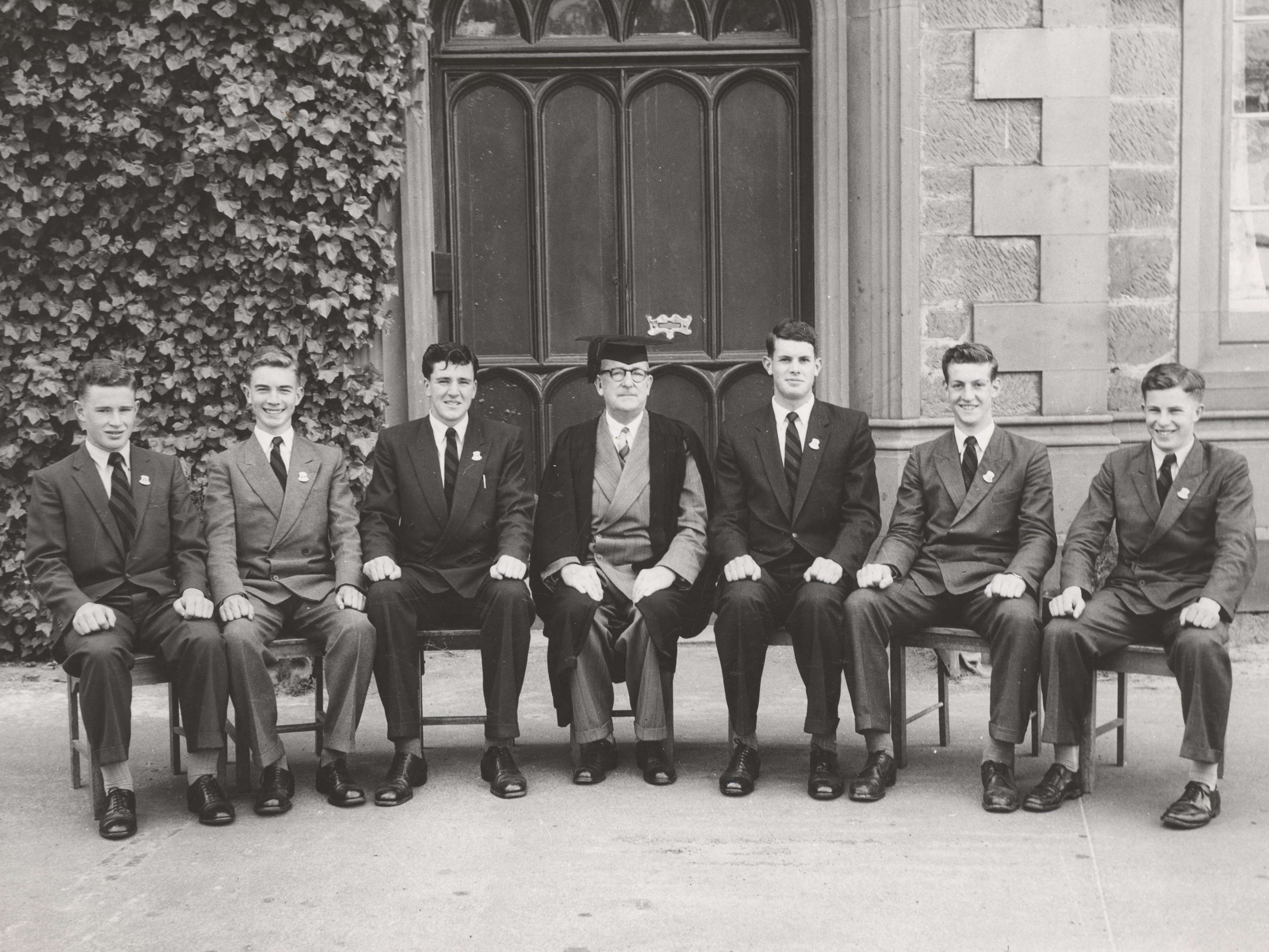 Headmaster H V Jones with Prefects, 1958. (L–R) T O Bayley, J D Fricke, R S Verrell, Headmaster H V Jones, N J Edwards, R K Brodribb, E A Downie.