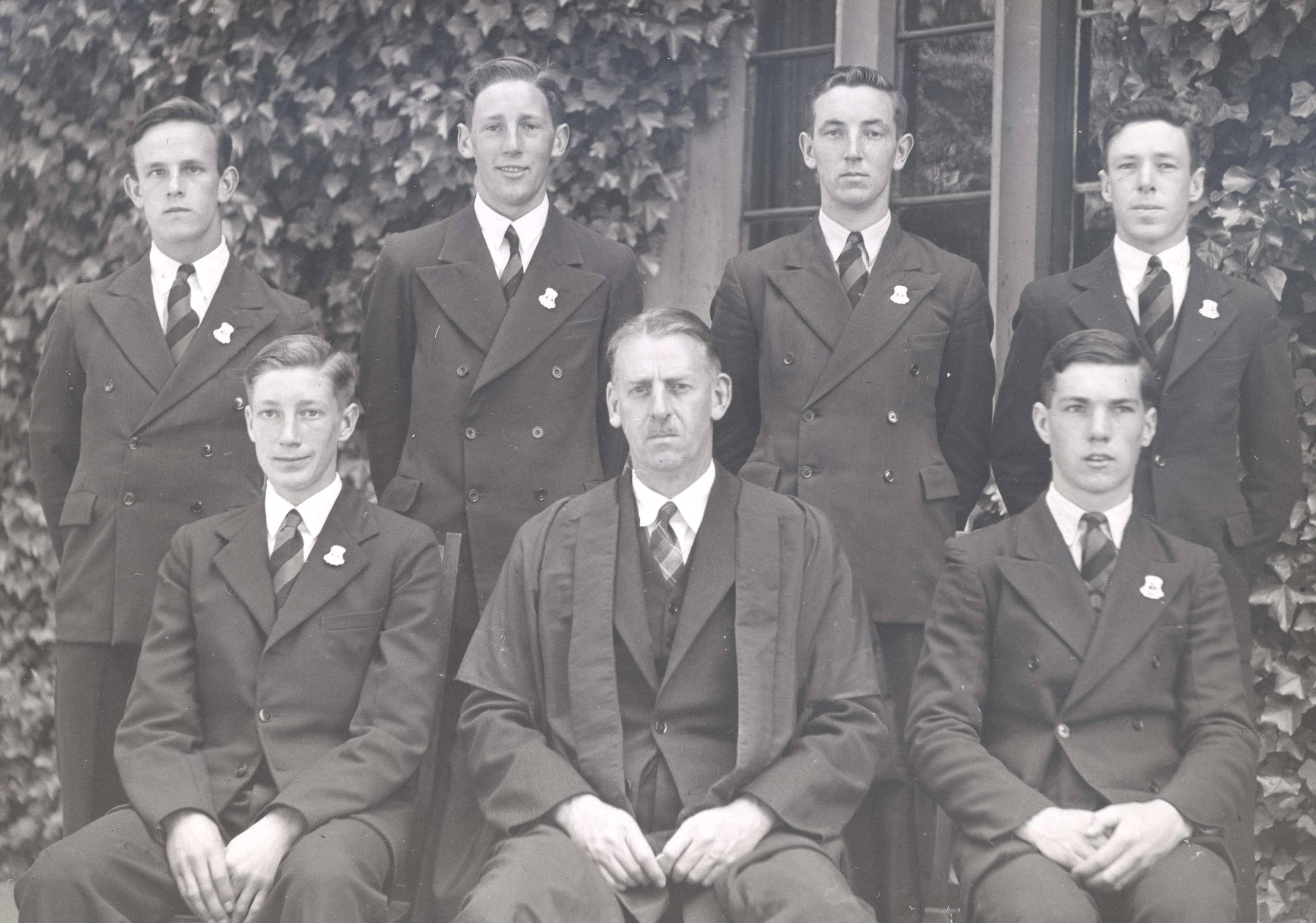 Headmaster V S Murphy with Prefects, 1943. (Standing L–R) P  J Lethlean, N J Ruddock, R H Ikin, E A Creese. (Seated L–R) G W Colman (Senior Prefect), Headmaster V S Murphy, R S Hay.