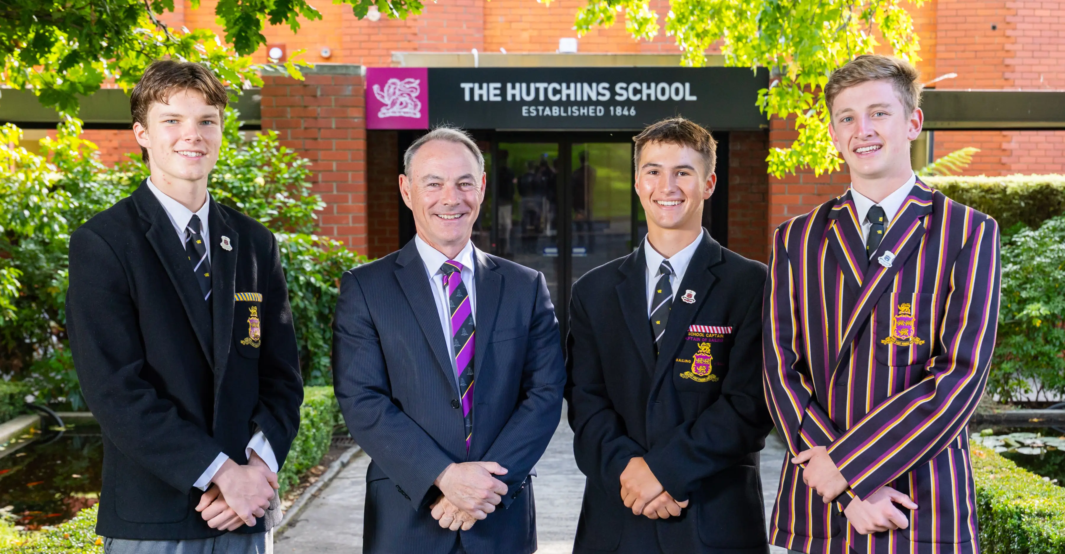 (L&ndash;R) School Vice Captain Otto Ford, Principal Dr Rob McEwan, School Captain Tom Fader, School Whip Jericoh Dickins (2026).