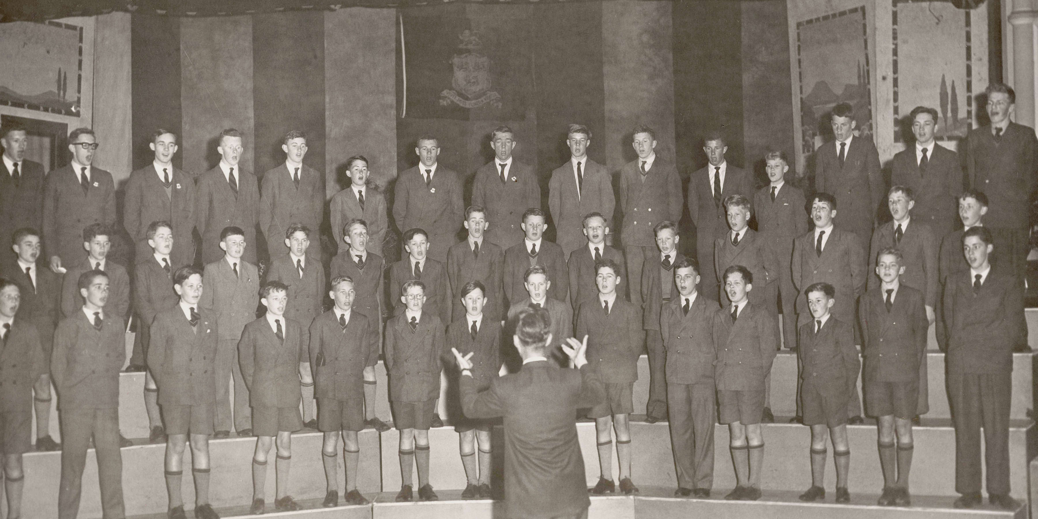 J M Boyes conducting the choir, 1957.