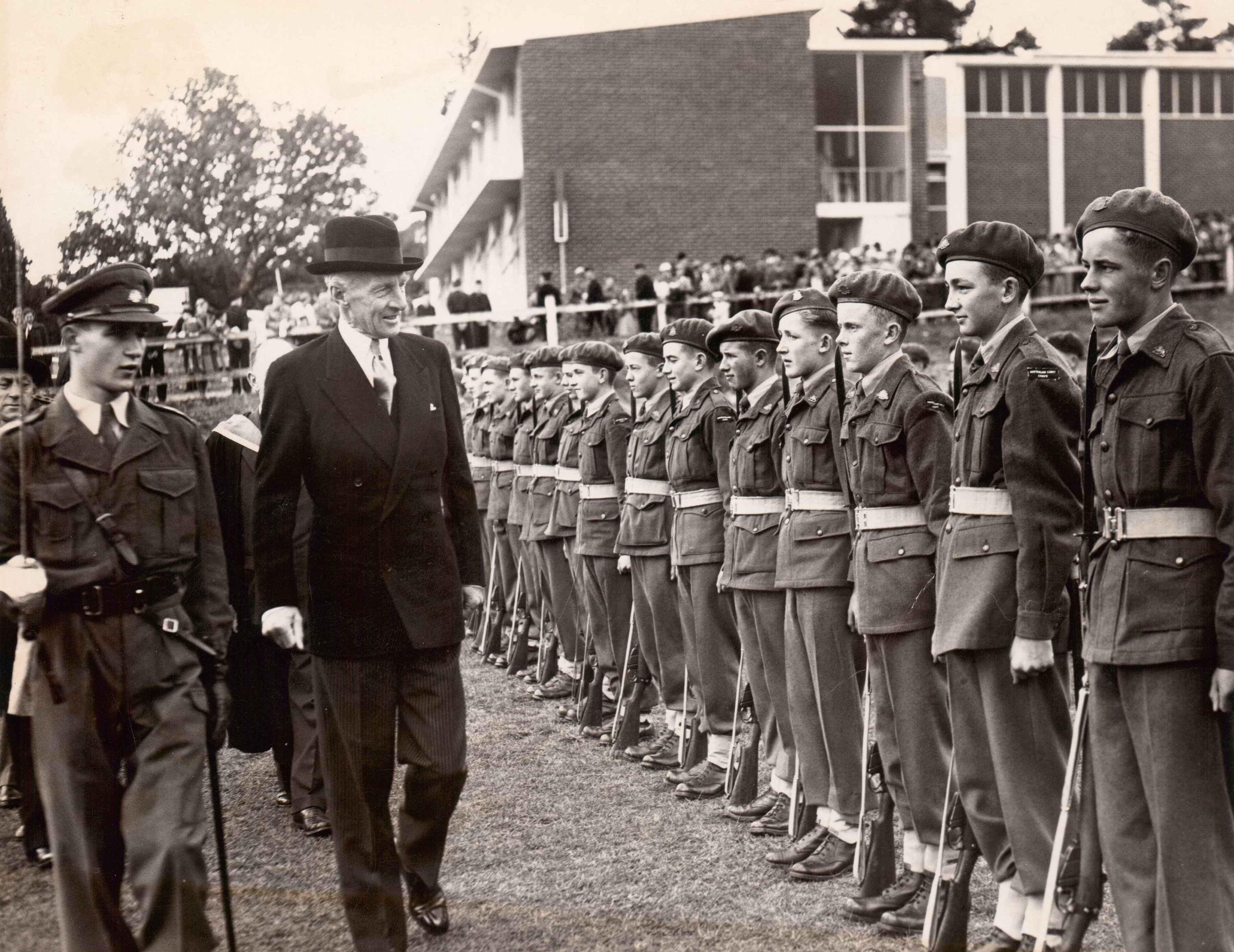 Governor Sir Ronald Cross inspecting Cadets at the opening of Junior School, 1957.