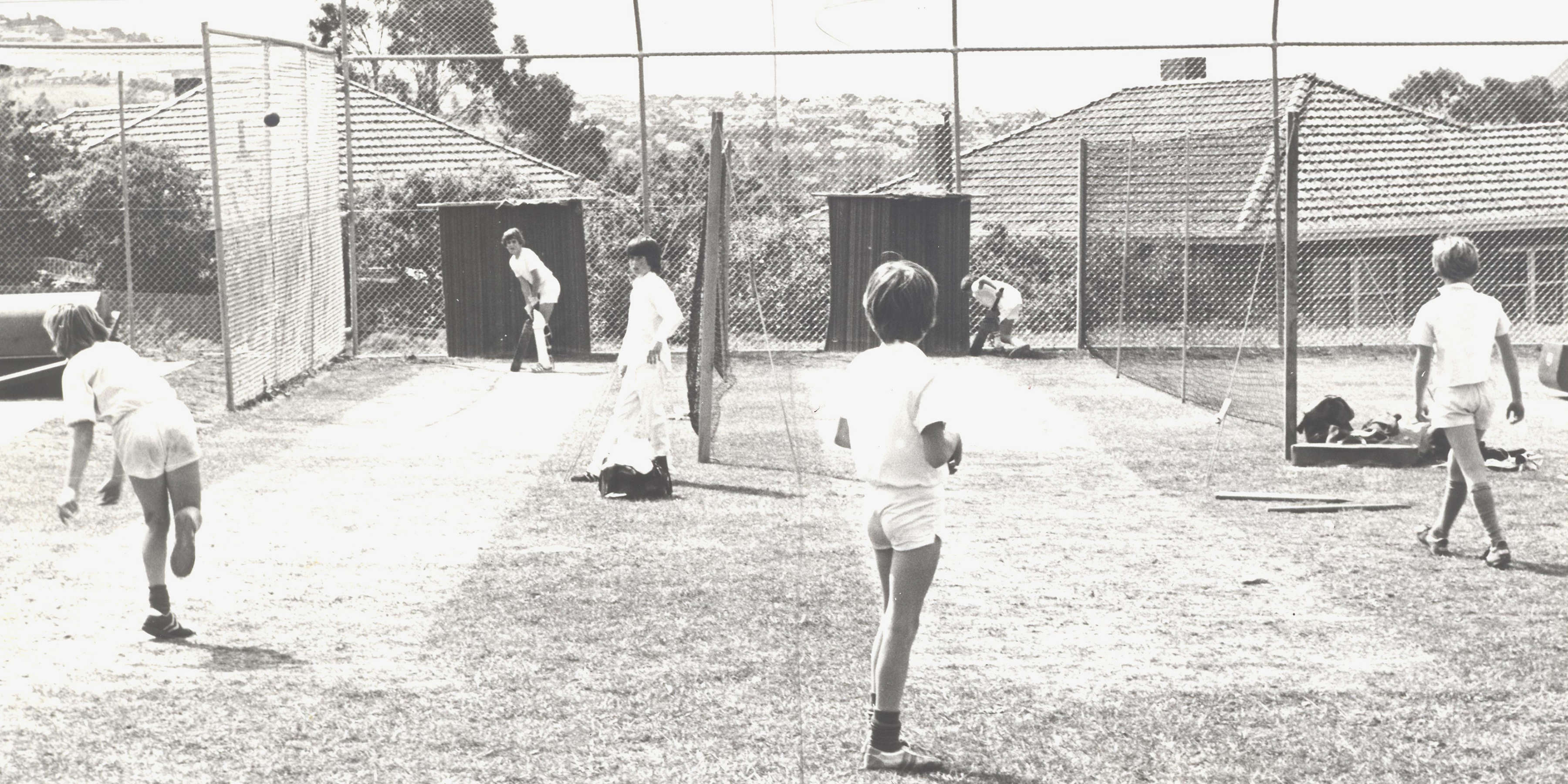 Junior cricket practice in the nets on the South Oval, 1977.