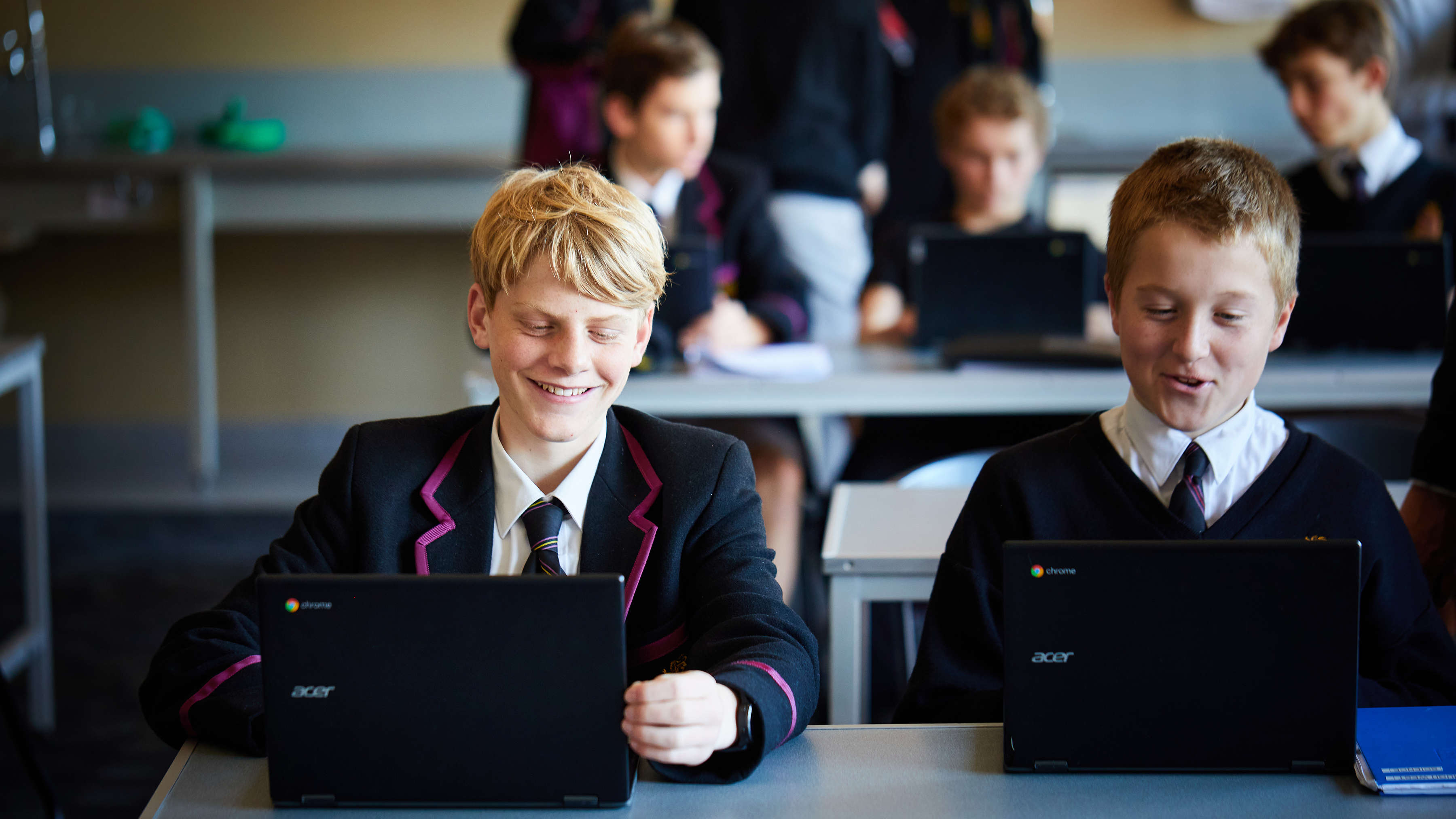 Students with their Chromebooks in a classroom. Photo: Joshua Lamont.