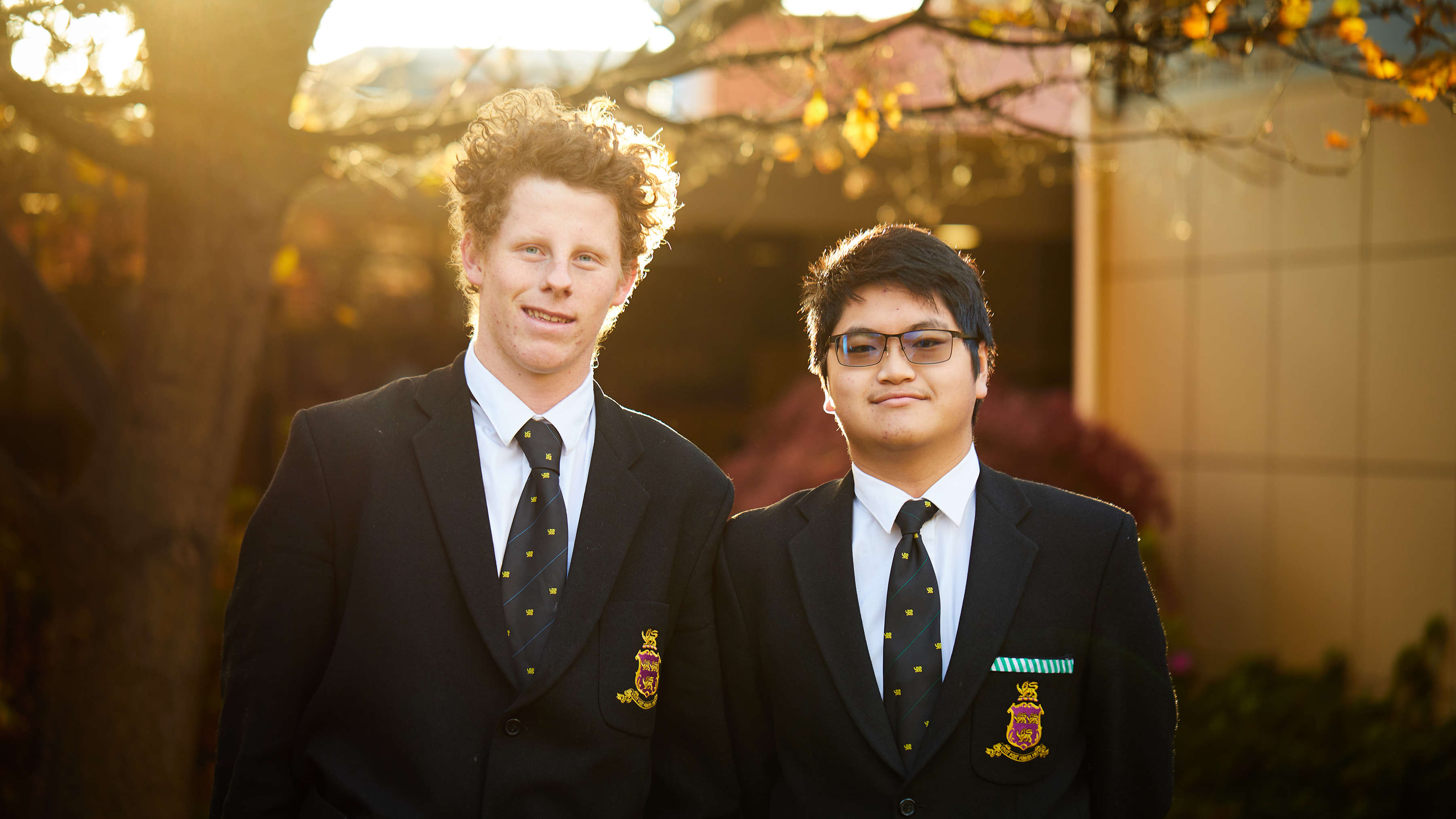 Two students outside the main entrance to The Hutchins School. Photo: Joshua Lamont.