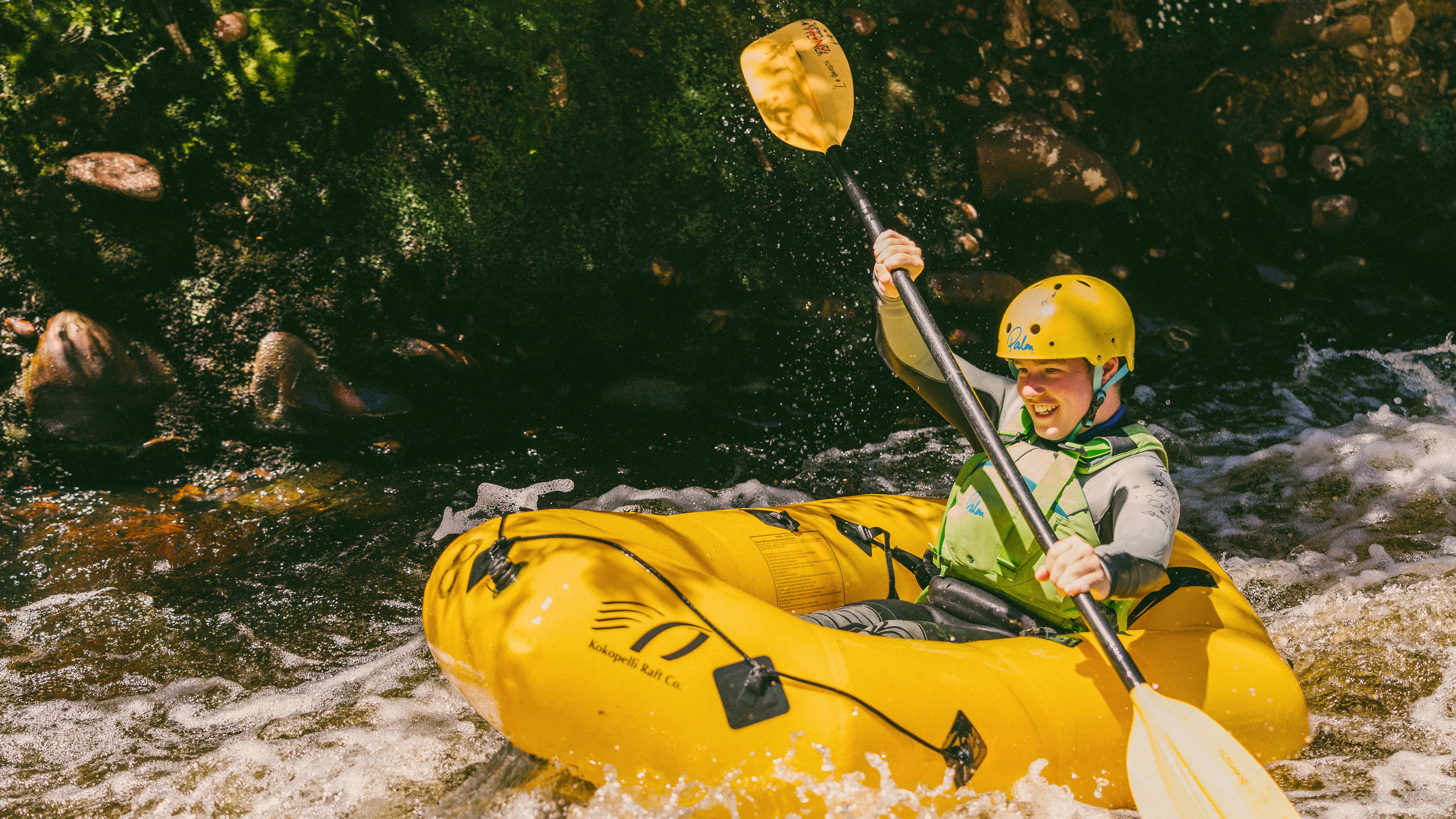 Power of 9 student kayaking.