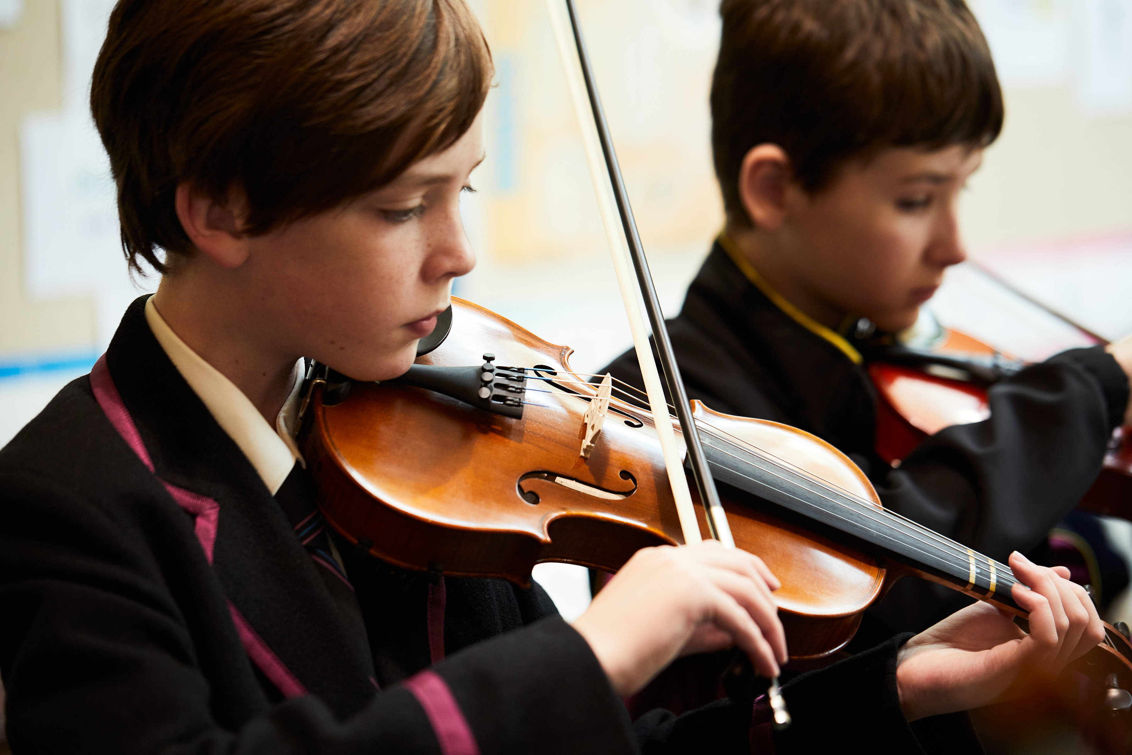 Two students playing the violin. Photo: Joshua Lamont.