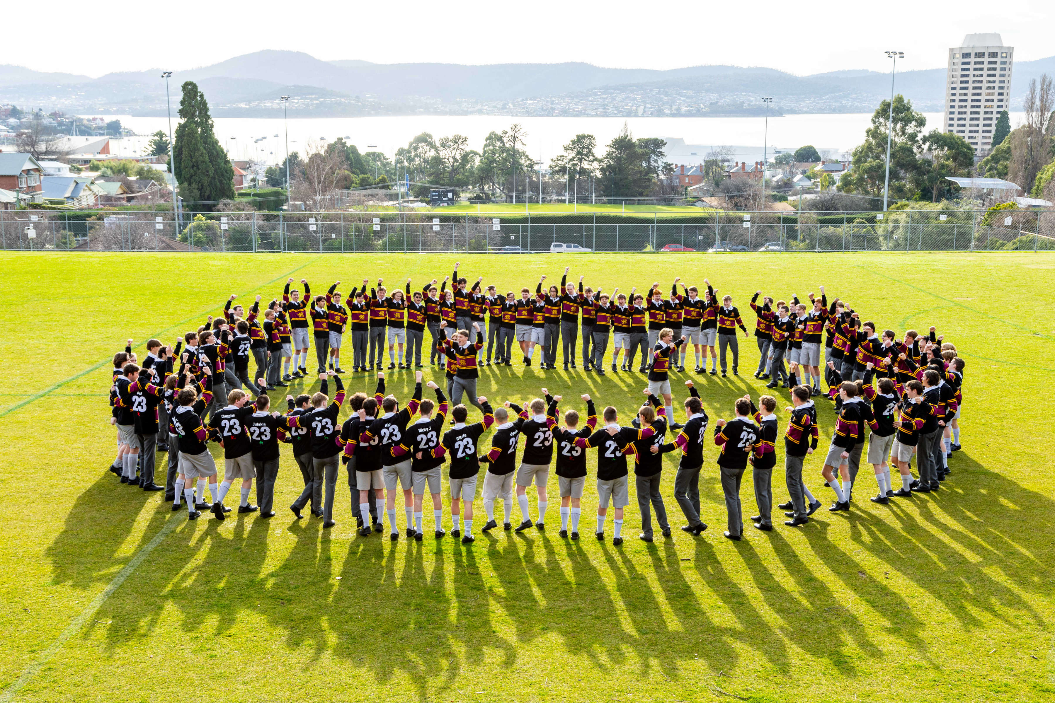 Hutchins students in a circle chanting the Year 12 War Cry.