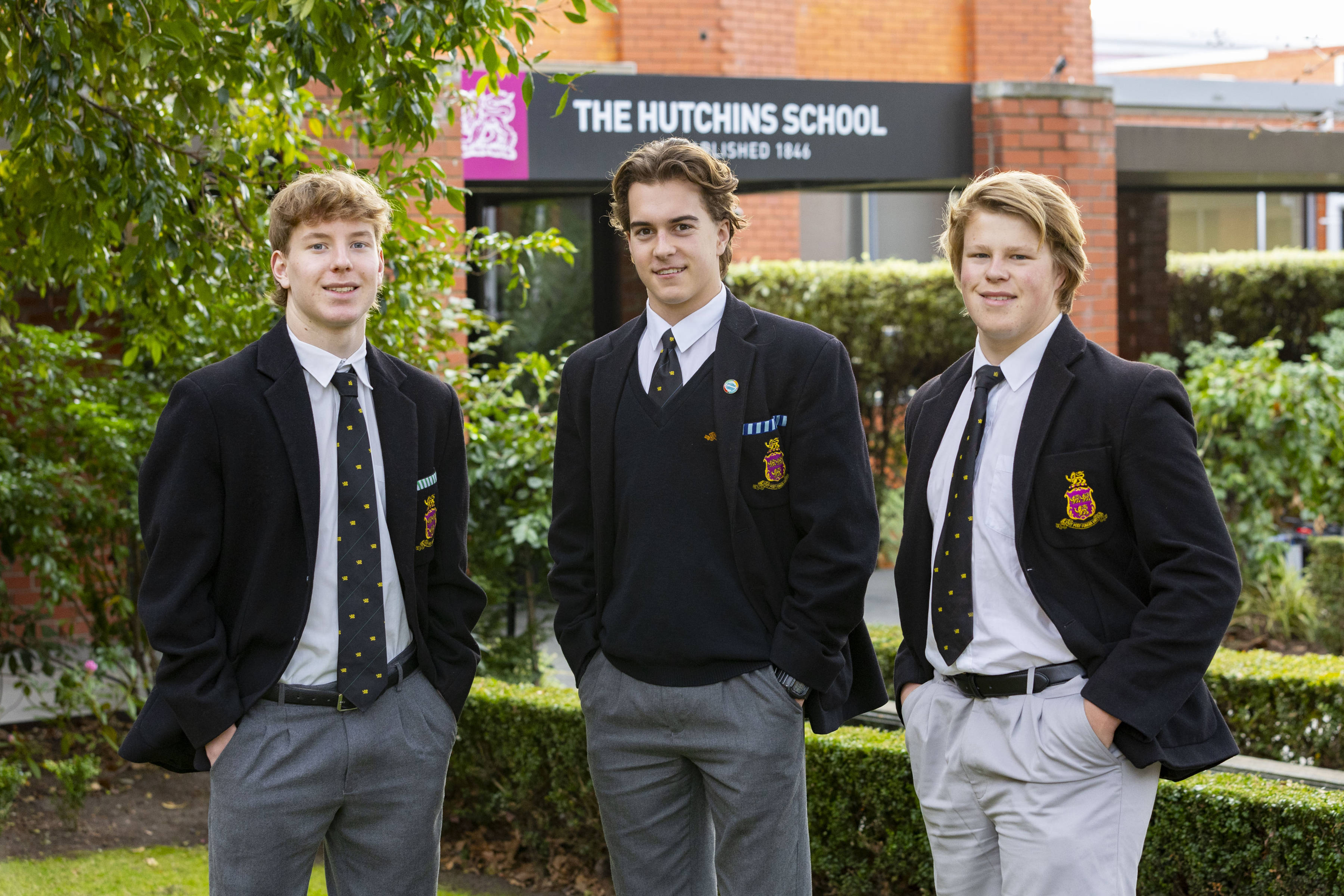 Three Hutchins students in uniform.